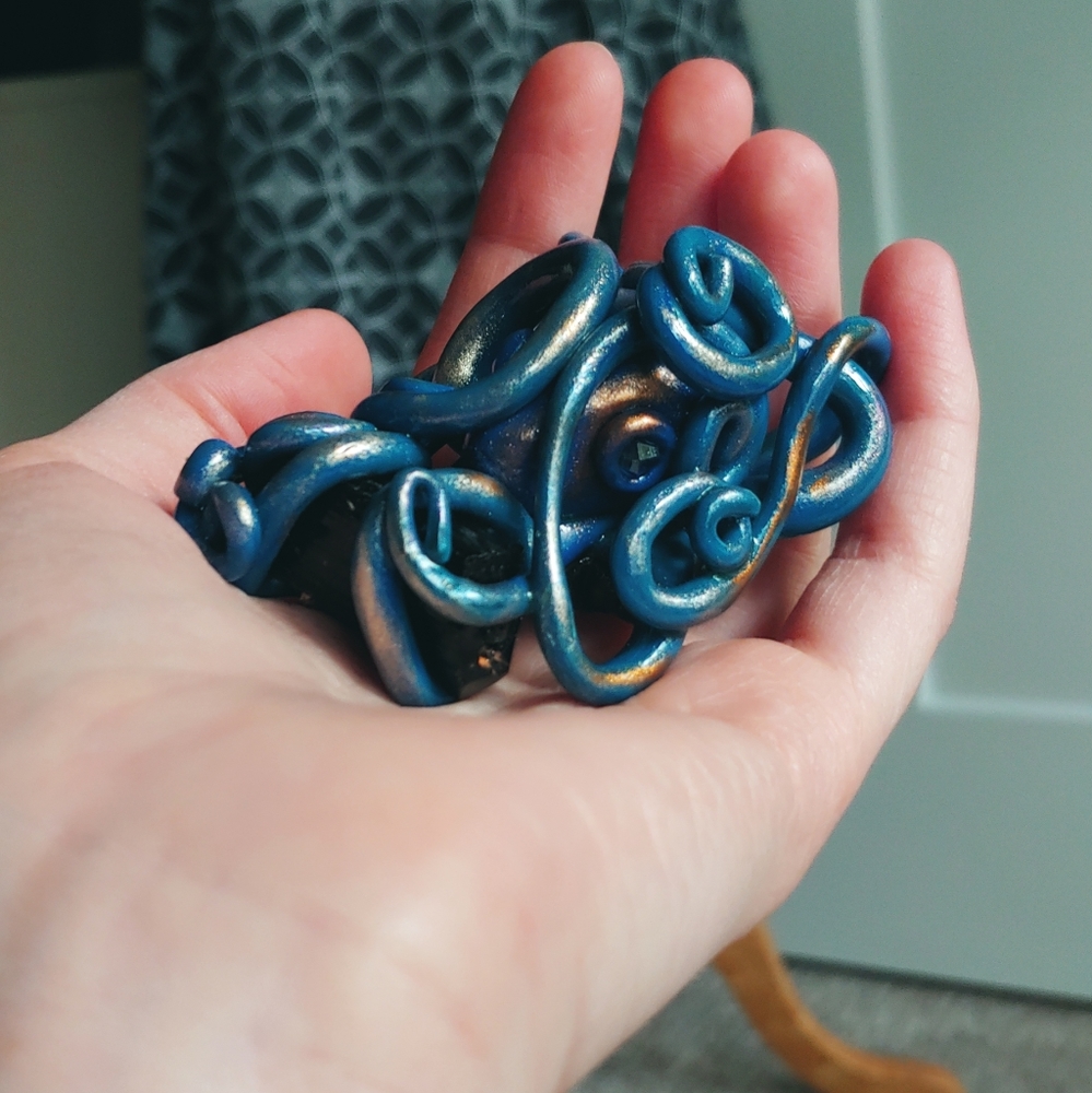 Black tourmaline blue shiny octopus
